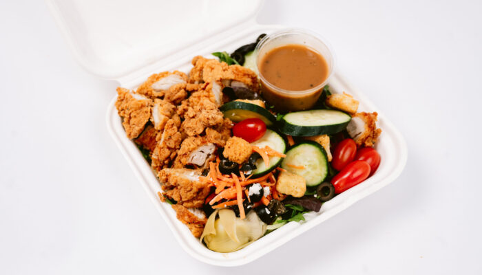 Fried chicken with veggies in to go box